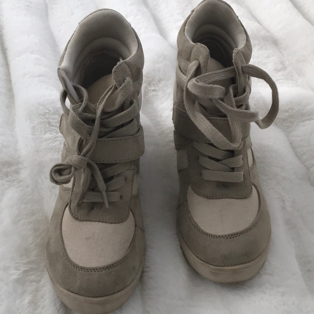High-top,tan-colored sneakers with a hidden wedge heel and velcro strap accents